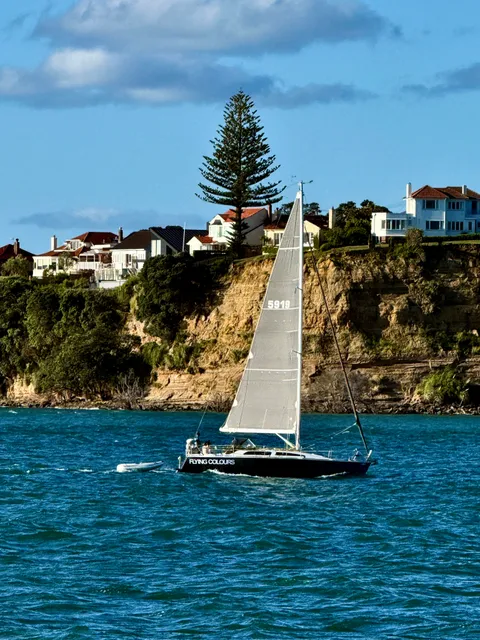 Sailboat on the water by the coast