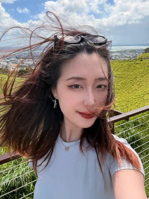 Portrait of Lyn Ling on a hillside